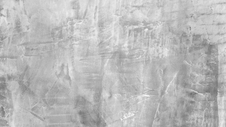 Close-up of raw cement stucco wall surface showing natural trowel texture and finish – Toms River Stucco