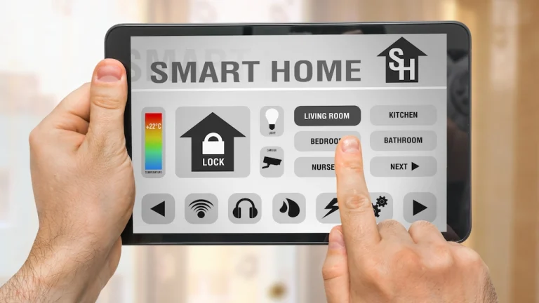 Hands holding a tablet with smart home control panel showing room and security settings – Toms River Stucco